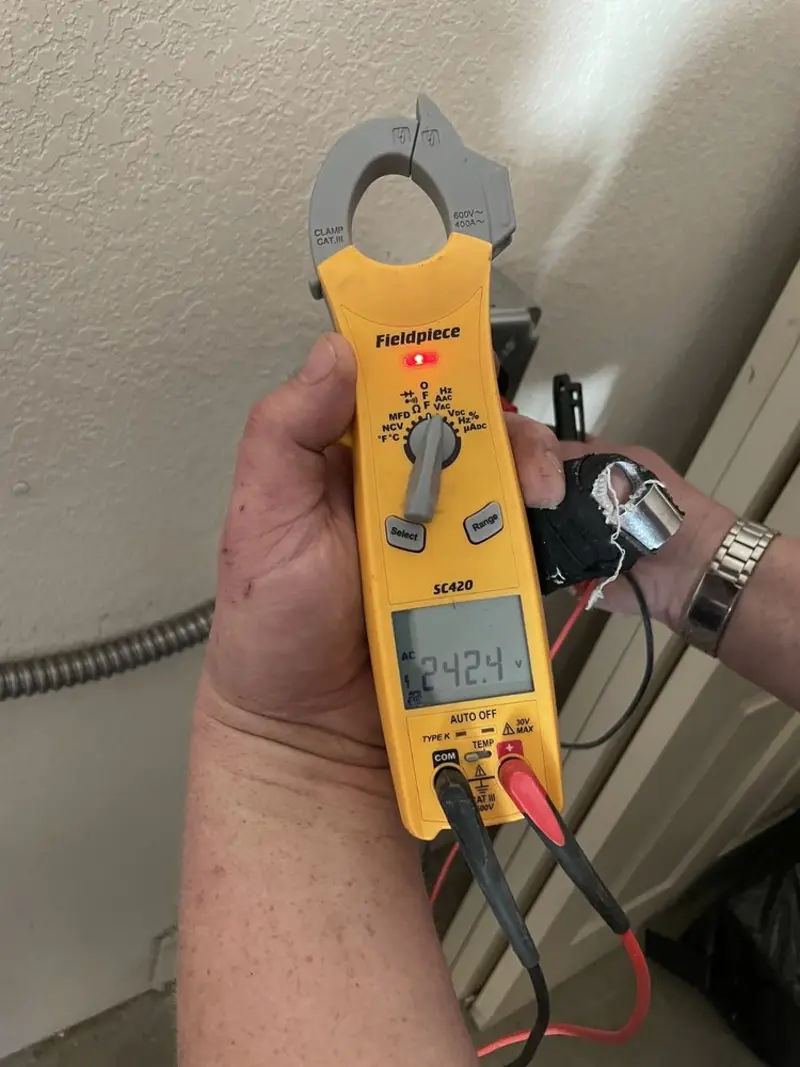 Voltage testing with clamp meter during Recessed Lighting Installation in Aurora